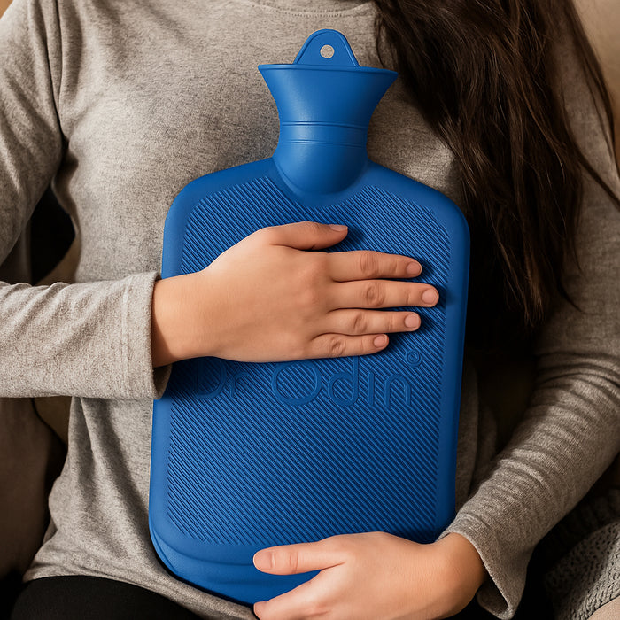 Person holding a blue hot water bottle with their hands