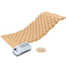 Beige inflatable mattress with pump and patches on a white background