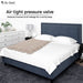 Bed with Dr. Odin air tight pressure valve feature, showing a cozy bedroom setting.
