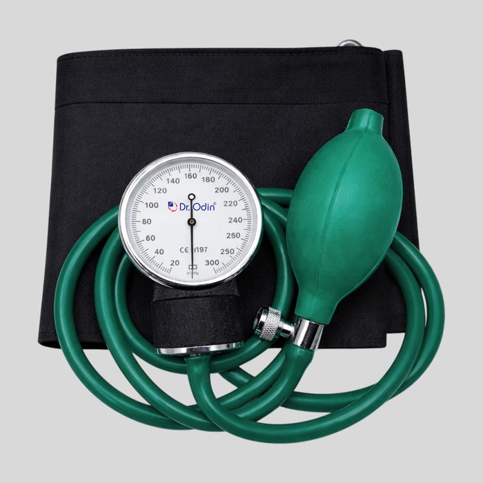 A Dr. Odin manual blood pressure monitor with a black fabric arm cuff, green inflation bulb and tubing, and a white dial gauge, shown on a neutral gray background.