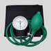 A Dr. Odin manual blood pressure monitor with a black fabric arm cuff, green inflation bulb and tubing, and a white dial gauge, shown on a neutral gray background.