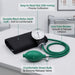 A blood pressure monitor set on a light gray tabletop, featuring a black cuff, green tubing, a green bulb, and a dial gauge. Text callouts highlight product features such as easy-to-read dial, durable black nylon cuff, one-tube bladder, and comfortable green bulb with chrome release valve.