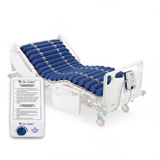 Hospital bed with blue air mattress and control panel on a white background
