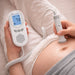 Digital fetal monitor being used on a pregnant belly