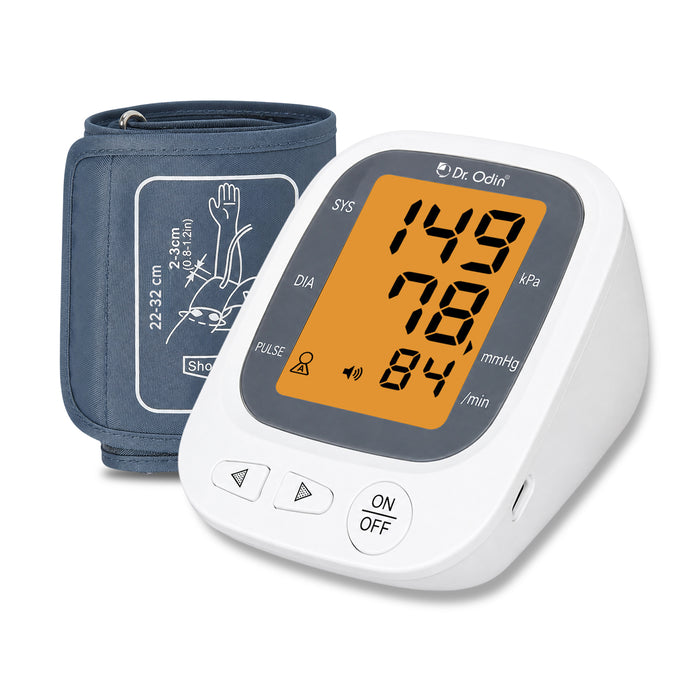 Blood pressure monitor with digital display and cuff on a white background